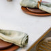 Boxhill's Aspect Dining Table Travertine Look lifestyle image close up view with plates on top
