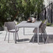 Boxhill's Vibe light grey / dusty rose outdoor armchair with light grey rectangular outdoor table placed in patio