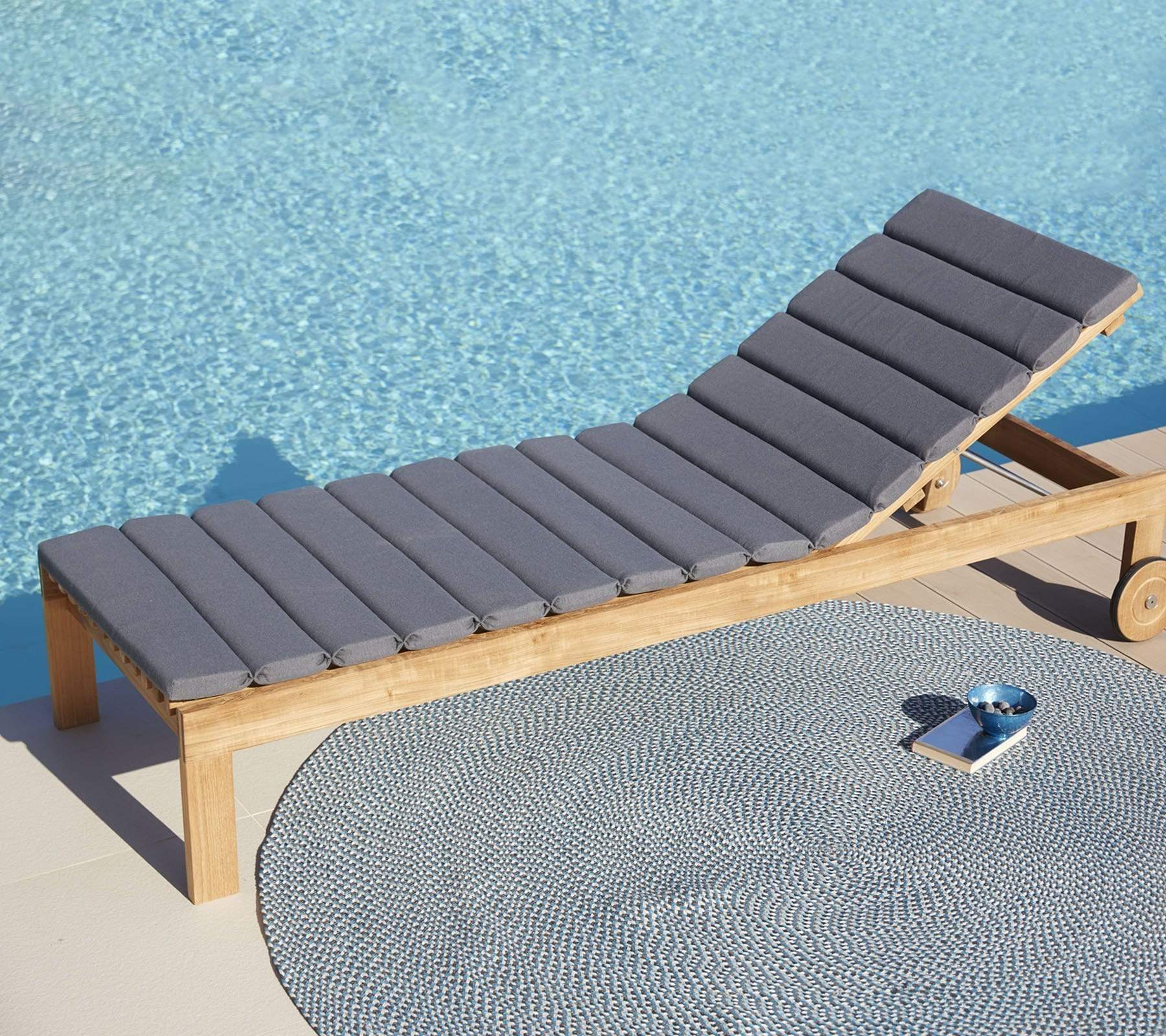 Boxhill's Amaze Chaise Lounge with cushion lifestyle image beside the pool