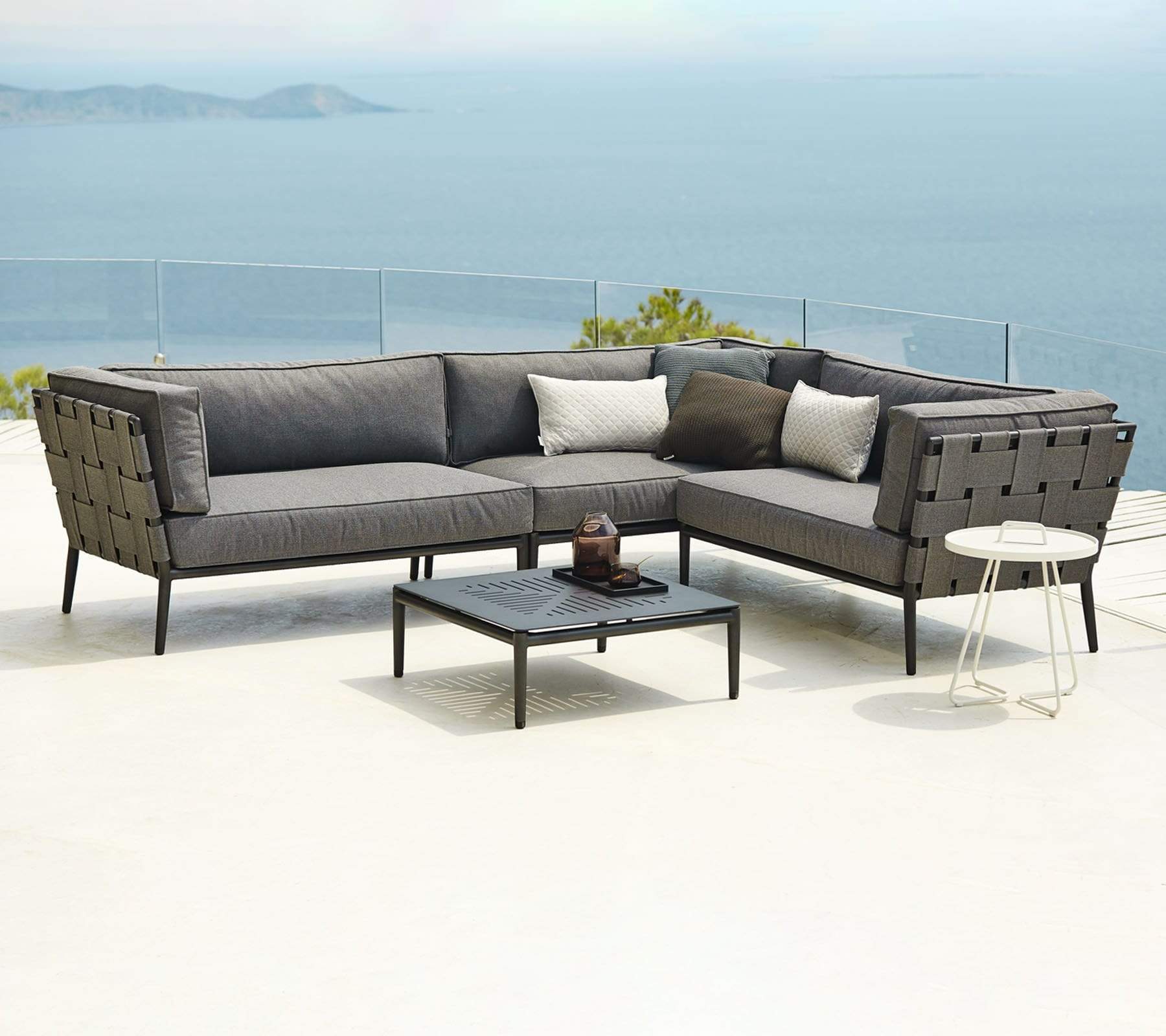 Boxhill's Conic Outdoor Coffee Table Grey lifestyle image with Conic Sectional Sofa
