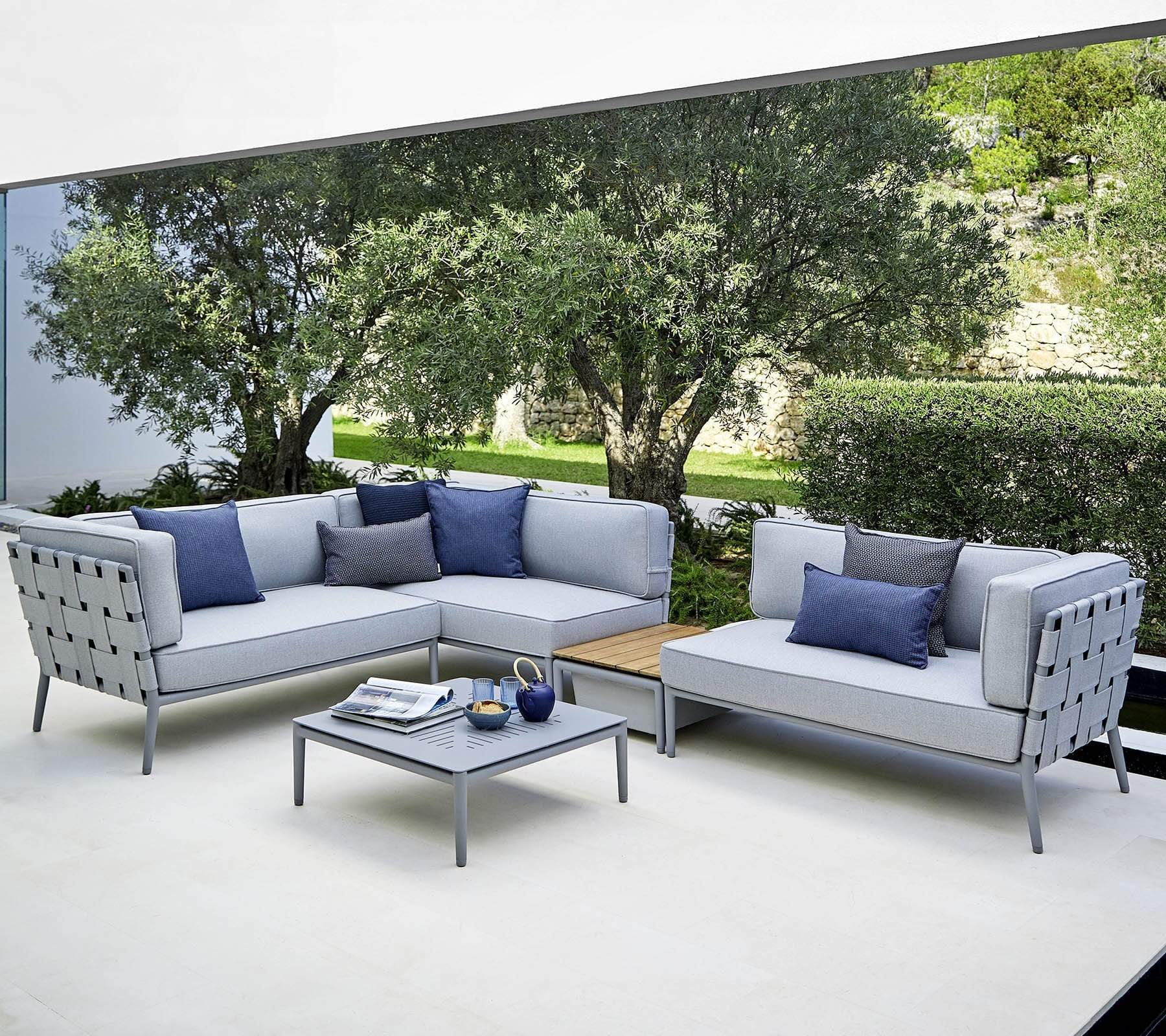 Boxhill's Conic Outdoor Coffee Table Light Grey lifestyle image with Conic Sectional Sofa and Conic Box Outdoor Storage Table at patio