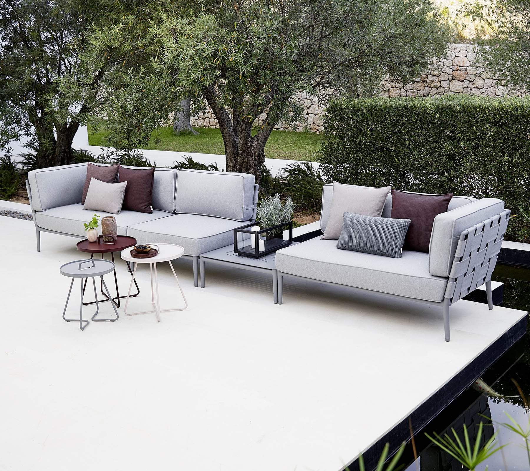 Boxhill's Conic Outdoor Coffee Table Light Grey lifestyle image with Conic Sectional Sofa at patio