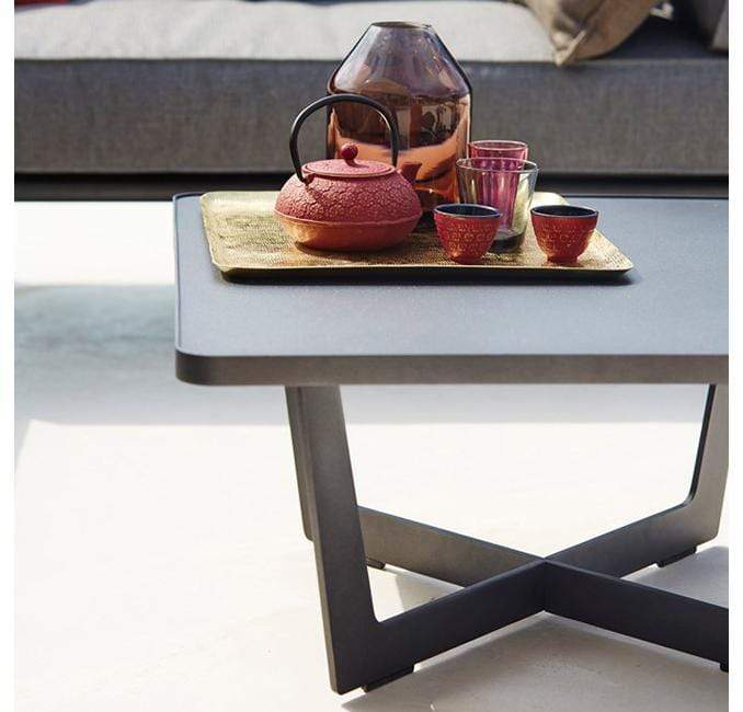 Boxhill's Time-Out brown outdoor small coffee table with tray, red pot and red cups on it
