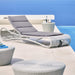 Boxhill's Escape Pool Side Sunbed White Grey Weave with Grey Cushion lifestyle image beside the pool