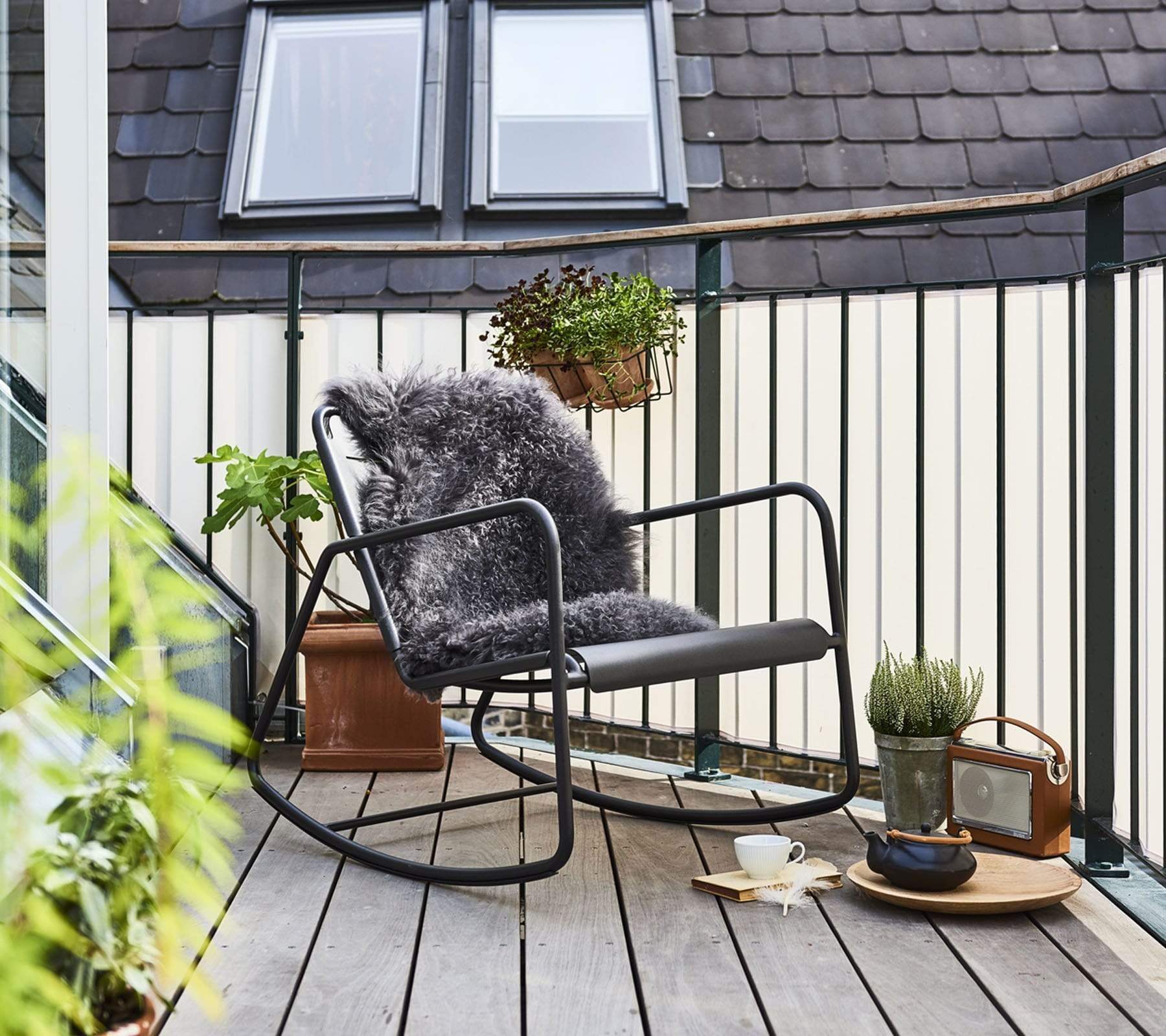 Boxhill's Copenhagen Rocking Chair lifestyle image on wooden balcony