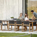 Boxhill's Endless Outdoor Dining Armchair lifestyle image with dining table, 2 women sitting down and a man standing at the side