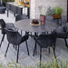 Boxhill's Vibe black outdoor armchair with dark grey round outdoor dining table placed in patio