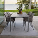 Boxhill's Vibe light grey / dusty rose outdoor armchair with grey rectangular outdoor dining table placed on wooden platform