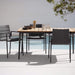 Boxhill's Core Garden Dining Table Lava Grey lifestyle image with Core Patio Dining Chair beside the pool