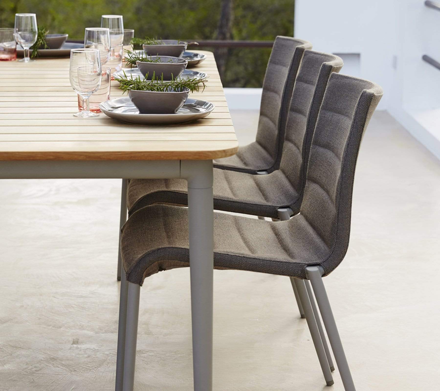 Boxhill's Core Garden Dining Table Taupe lifestyle image with Core Patio Dining Chair