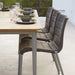 Boxhill's Core Garden Dining Table Taupe lifestyle image with Core Patio Dining Chair