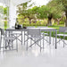 Boxhill's Drop Outdoor Dining Table Light Grey lifestyle image with dining chairs beside glass wall at patio