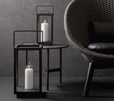 Boxhill's Lighthouse Lantern lifestyle image on top of round table beside the chair