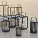 Boxhill's Lighttube Outdoor Large Lantern | Set of 2 lifestyle image with Lighthouse Outdoor Large Aluminum Lantern and Lighthouse Outdoor Large Teak Lantern at seafront