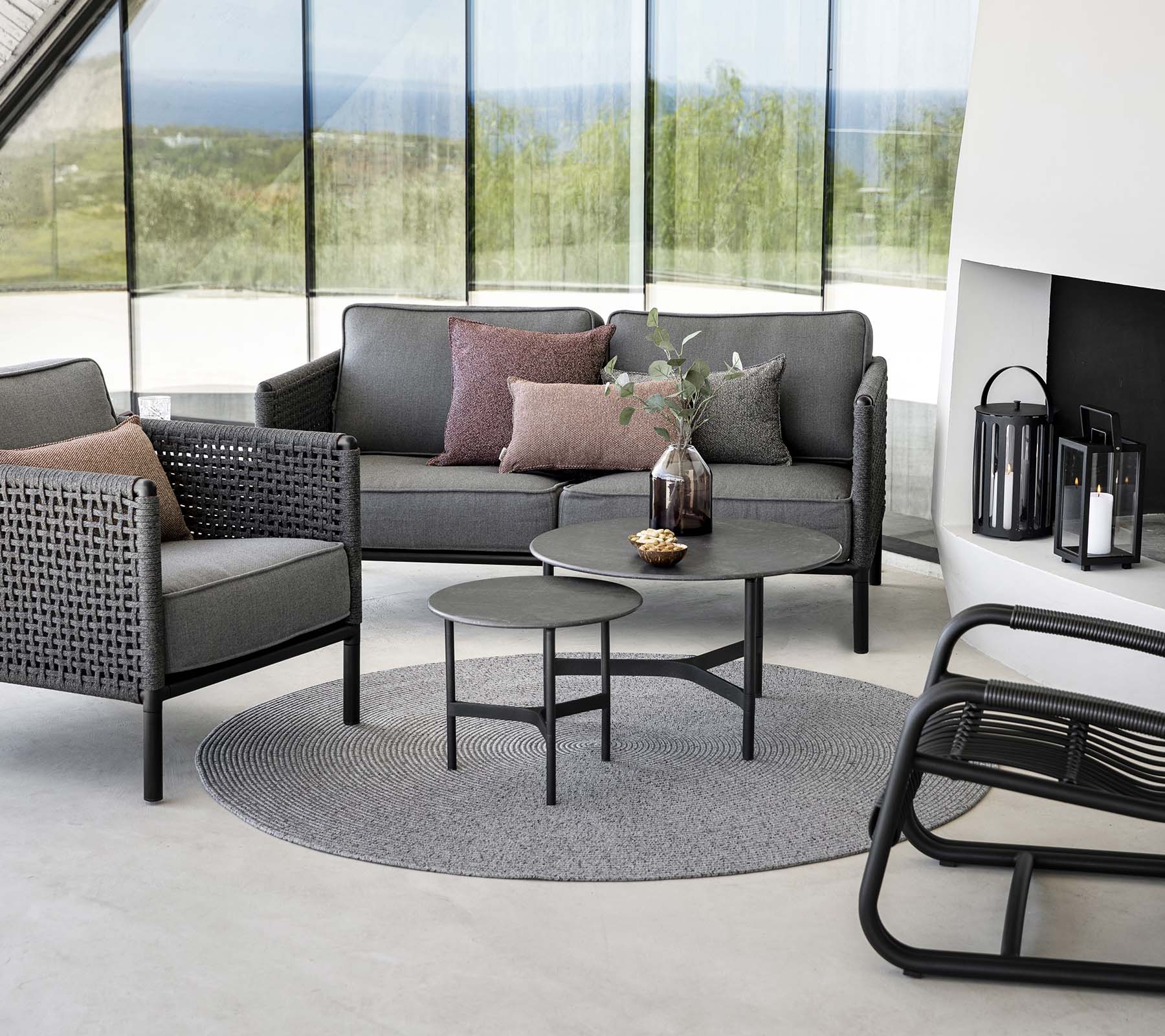 Boxhill's Circle Outdoor Rug Grey lifestyle image with 2 seater sofa and club chair