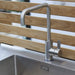 Boxhill's Drop Outdoor Kitchen Module with 3 Shelves lifestyle image with Teak Wall and Stainless Faucet