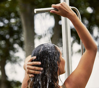 Boxhill's Lagoon Outdoor Shower lifestyle image with a woman taking a shower
