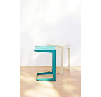 Boxhill's Time-Out white and aqua green outdoor side table placed against white wall