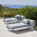  Boxhill's Space light grey outdoor 2-seater sectional sofa with grey outdoor side table set on outdoor patio
