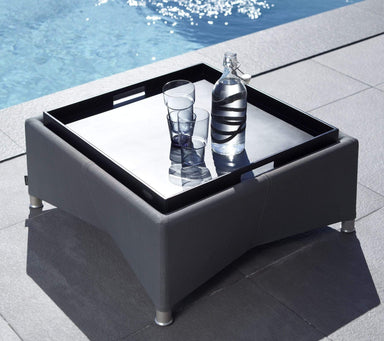 Boxhill's Club Outdoor Square Tray lifestyle image with bottle and glass of water beside the pool